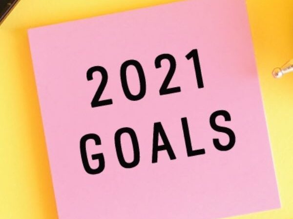 January 2021 feature image of pink posted note with "2021 Goals" written on it