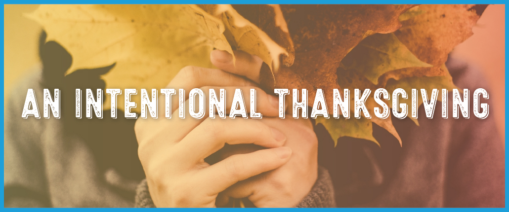 a bouquet of autumn leaves with the text overlay of "An Intentional Thanksgiving"